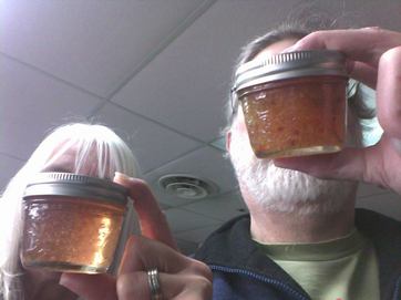 Photo of two different jelly samples and two people holding them.